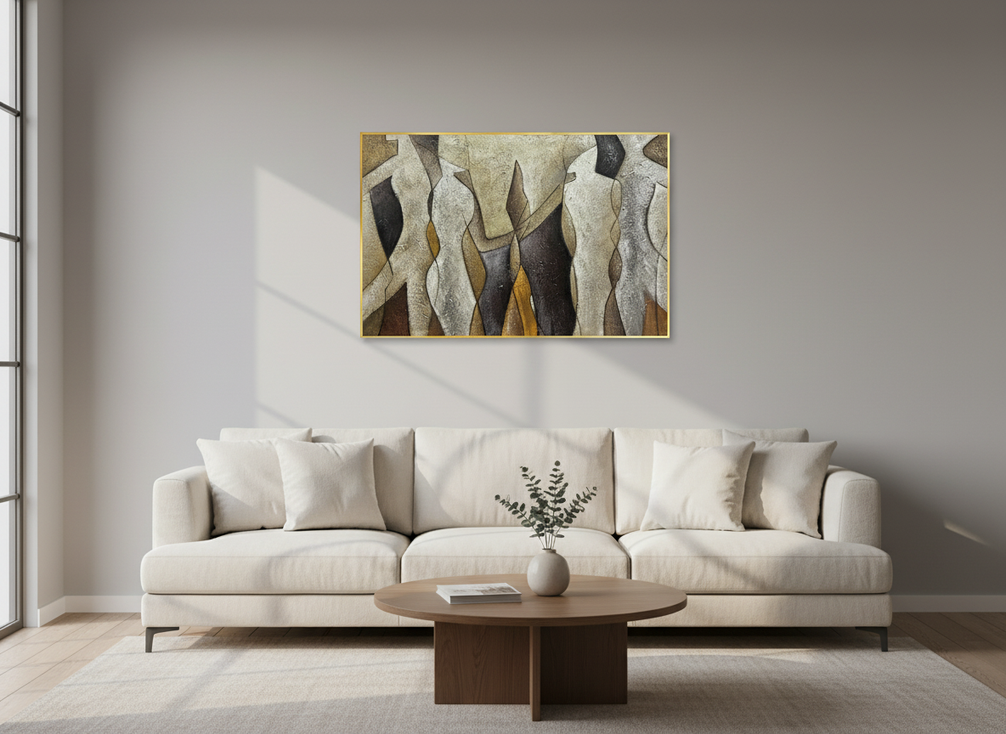 A framed textured abstract oil painting with warm neutral tones displayed on a bright living room wall above a sofa, styled as a thoughtful housewarming gift