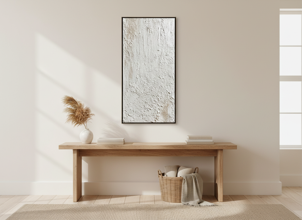 Textured abstract wall art in a welcoming entryway above a console table with warm neutral decor