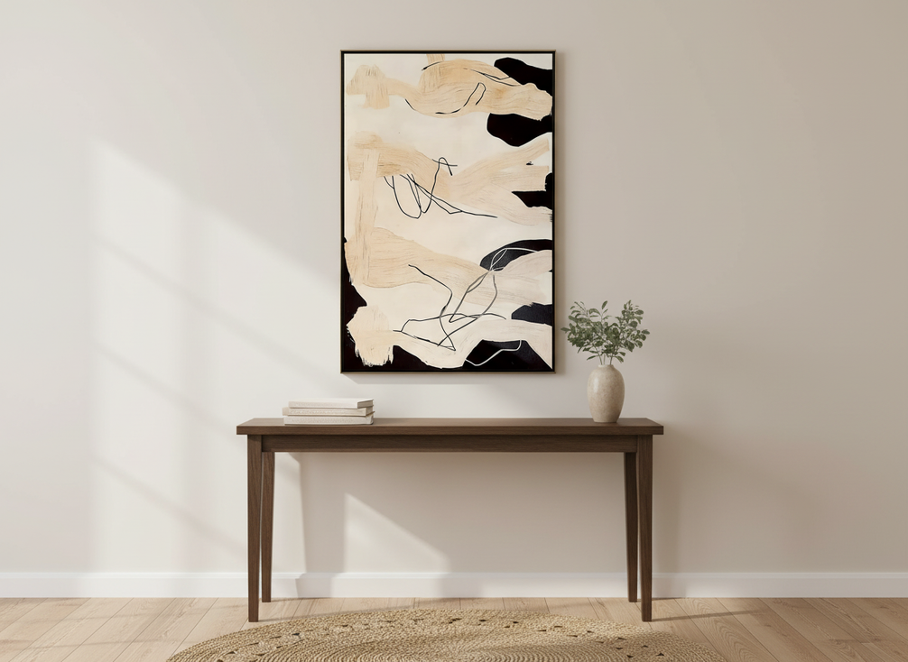 Vertical textured abstract painting displayed above a narrow entryway console in a welcoming foyer