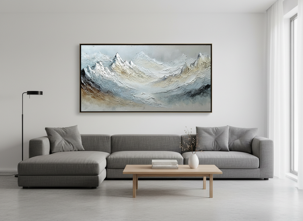 Textured mountain landscape painting shown as a framed wall artwork in a bright modern living room
