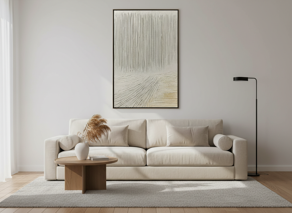 Textured abstract wall art in a modern room with warm neutral tones and natural light