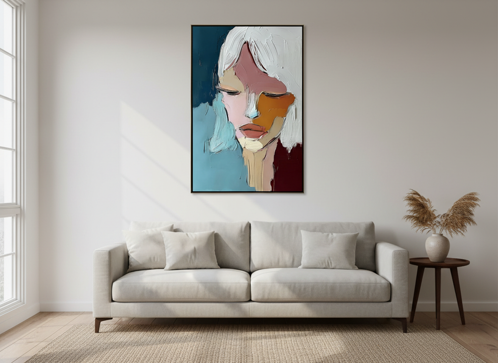 Heavily textured abstract portrait painting with raised brushwork, shown as a modern wall art piece in a softly lit living room
