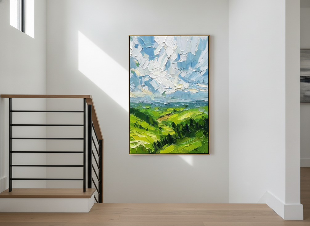 Tall staircase wall with a vertical framed artwork placed in a narrow open section beside a railing, shown from below to assess fit and sightlines.