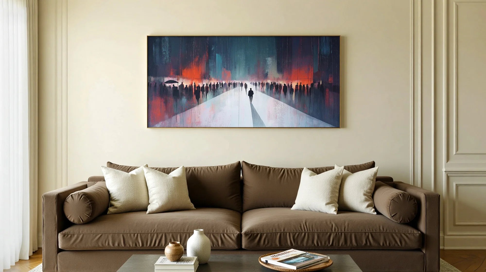Abstract painting of figures on a path hangs above a brown sofa in a living room.
