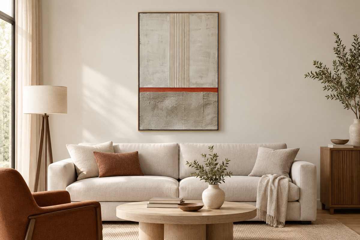 Vertical framed abstract landscape painting centered on a light wall above a simple console.