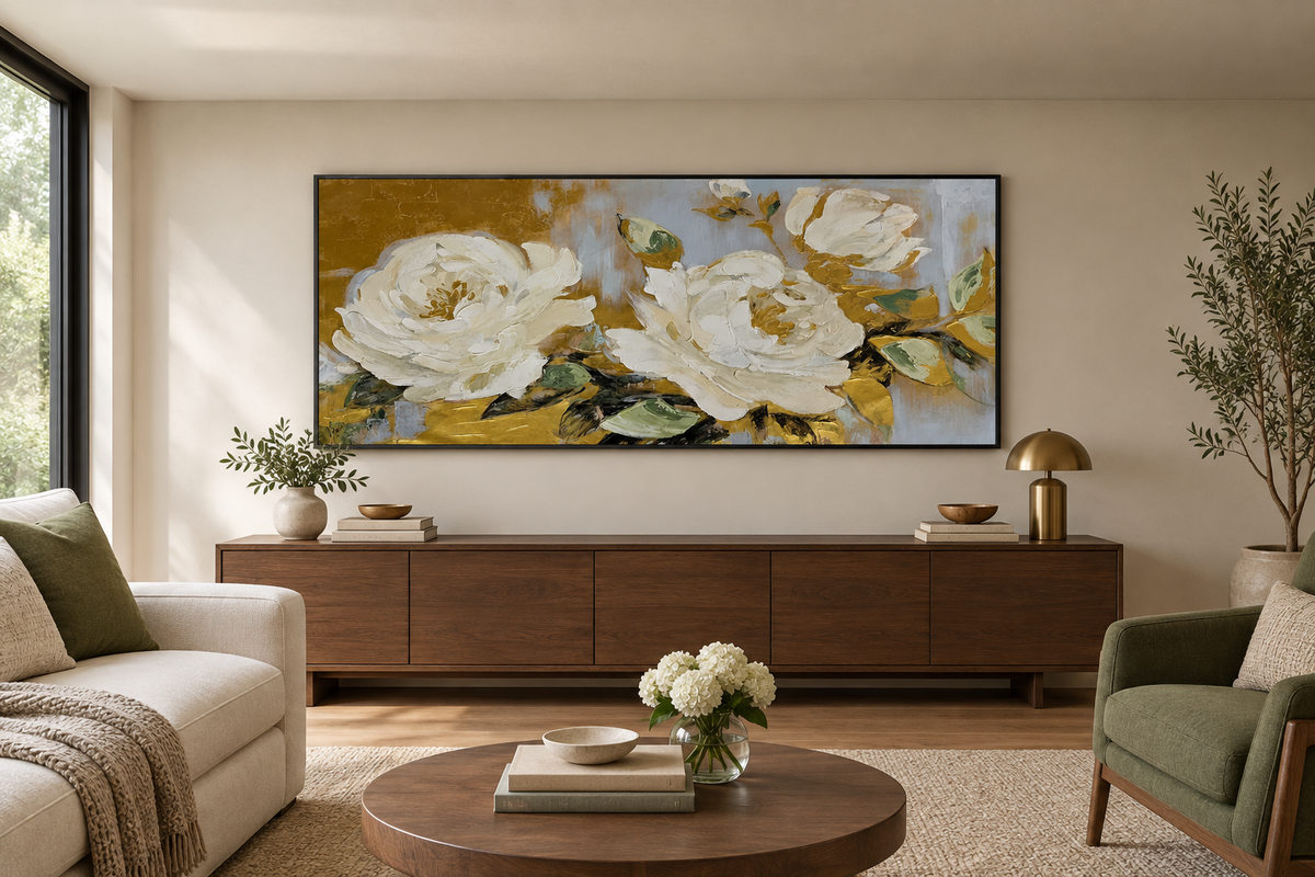 Horizontal floral artwork displayed above a console in a low-ceiling living room with warm furnishings.