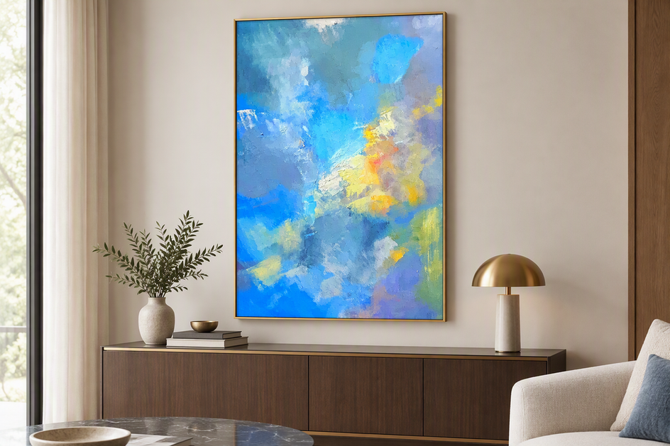 Textured abstract painting displayed in a finished frame above a living room console, with its raised surface clearly visible.