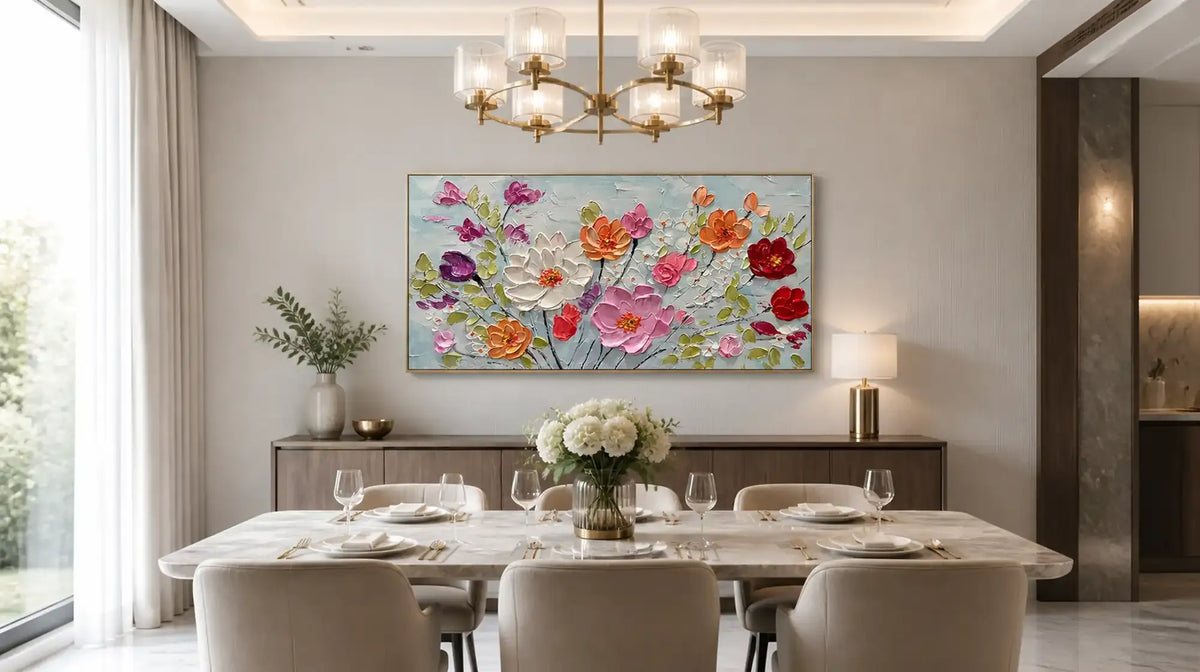 Dining room with a large framed floral painting above a wooden sideboard and set table