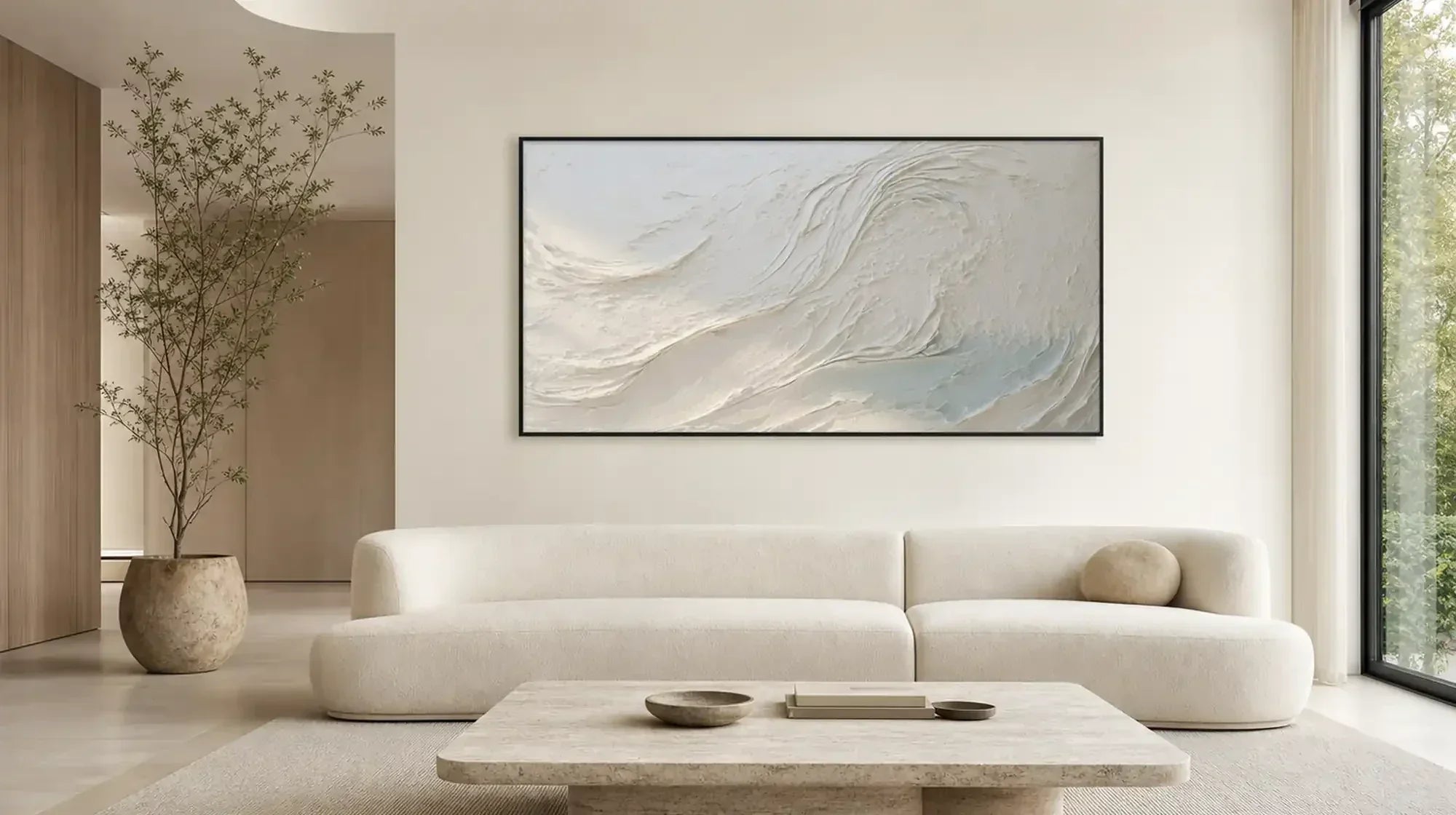 Cream wave-textured minimalist canvas above a white living room sofa.