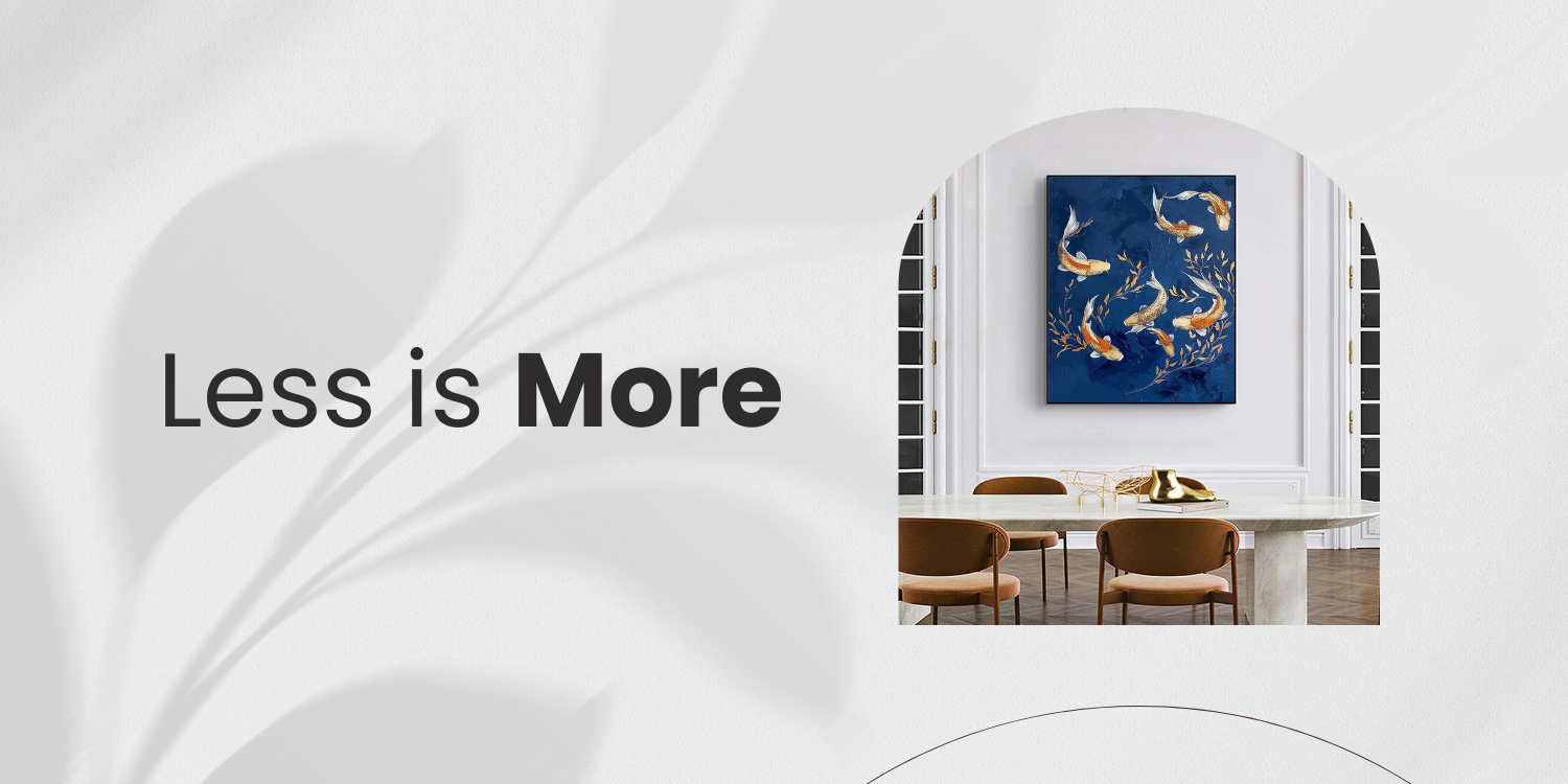 Minimalist blue abstract wall art beside "Less is More" text in a white dining room