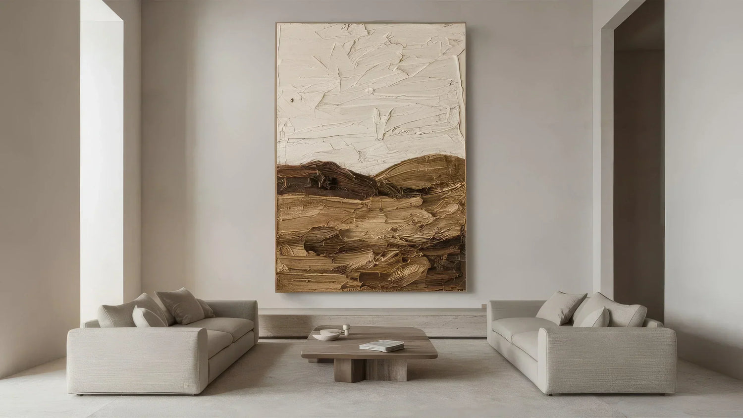This image depicts a minimalist living room with a large abstract painting in earthy tones as the focal point.