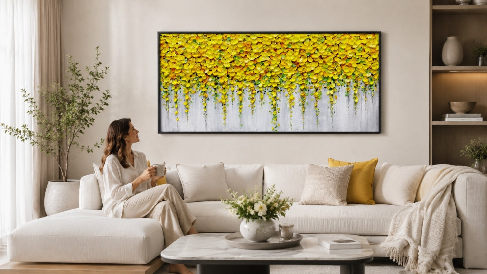 Wide yellow botanical wall art above a white sofa in a clean living room