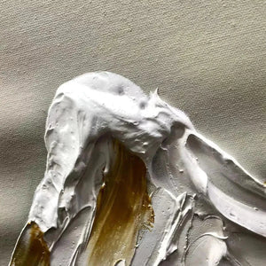 Close-up impasto painting texture: thick white peaks with gold accents on canvas, showcasing material quality.