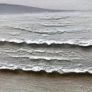 Close-up of 'Whispering Tides' painting showing thick impasto texture of beige sand and white frothy waves.