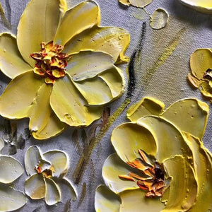 Textured impasto Golden Sunflowers close-up, revealing deeply sculpted yellow petals and prominent three-dimensional details.