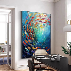 Willow Davies' 'Whirlpool of Fish' vertical artwork with vibrant swirling fish, elegantly placed in a modern dining room.