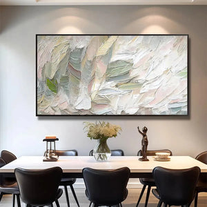 Pink Whispers textured abstract painting with soft pink, sage green, white impasto brushstrokes above dining table.