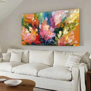 Large 'Summer Bouquet' impressionistic painting, vibrant floral art above a cream sofa in a modern living room.