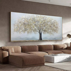 Golden Tree painting by Javier Ramirez, gold and grey textured art, framed, over a brown sofa. Modern home decor.