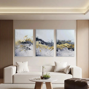 Gold & Grey Abstract Triptych: 3 vertical paintings with impasto texture, displayed above a modern sofa.