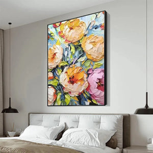 Textured impasto floral painting in yellow and pink, displayed in a bedroom setting. Elodie Dubois art.