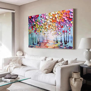 Textured impasto forest painting, vibrant leaves, pale blue sky, Liam O'Connell artwork in living room.