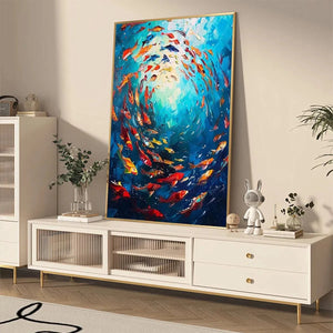 Yan Nan Li's Coral Reef Dance painting: Colorful fish artwork in dynamic swirling movement, gold frame.