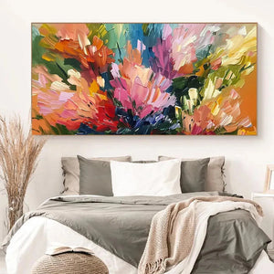 Elodie Dubois 'Summer Bouquet' vibrant impressionistic floral painting displayed above a neutral bed in a modern bedroom.
