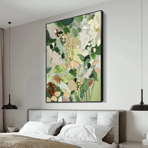 Textured abstract floral painting 'Whispering Meadow' in green and gold over a bed in a bedroom lifestyle shot.