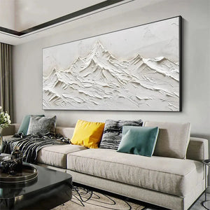 Textured white abstract mountain painting by Javier Ramirez, horizontal minimalist art over sofa in living room.