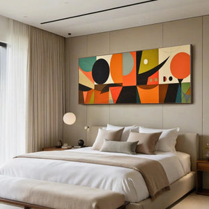 Panoramic mid-century modern geometric abstract painting in orange, black, and green above a bed.