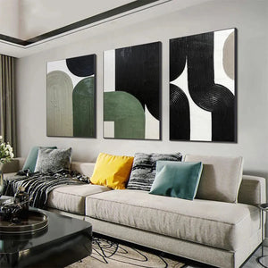 ARCHES TRIPTYCH abstract art set featuring textured minimalist arches in black, green, and beige, displayed above a sofa.