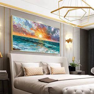 Vibrant impasto Ocean Sunset artwork with textured waves in a gold frame, creating a calming focal point in a modern bedroom.