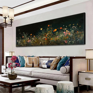 Panoramic wildflower painting: pink, orange, yellow blooms on dark background, displayed in a room setting.
