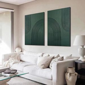 Green Textured Arches Diptych: two square textured abstract paintings with raised arches, displayed above a white sofa.