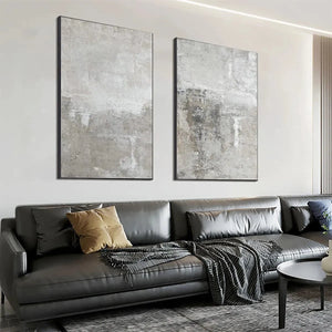 Javier Ramirez Grey Abstract Textured Diptych on a wall, featuring two vertical grey abstract paintings, modern home decor