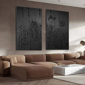 Liam O'Connell Black Textured Diptych: Abstract black paintings with textured surface and black frames, vertical wall art.