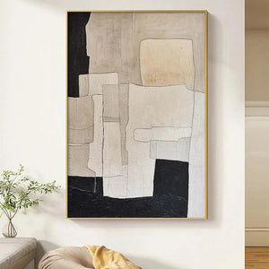 Minimalist abstract wall art in neutral beige and black tones, geometric shapes in gold frame.