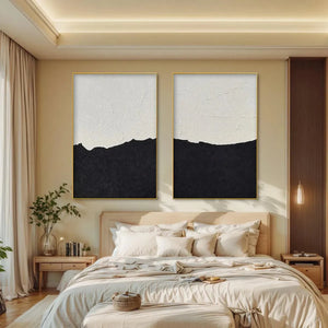 Black and white abstract landscape diptych by Liam O'Connell, vertical textured wall art, gold frame, modern bedroom decor.