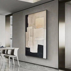 Javier Ramirez minimalist abstract painting in beige and black with geometric shapes on a grey wall.