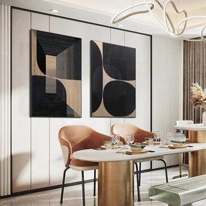 Set of 2 minimalist geometric abstract paintings in black, grey, and beige, displayed in a modern living room.