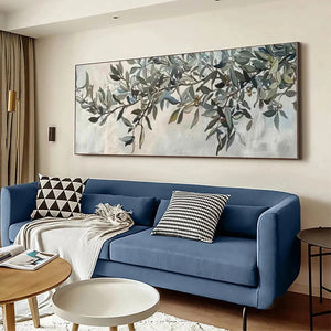 Liam O'Connell's panoramic olive branch painting on wall above blue sofa