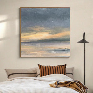 Stormy Seascape by Liam O'Connell square framed art, dramatic ocean in grey, yellow, and blue hues. Wall art above bed.