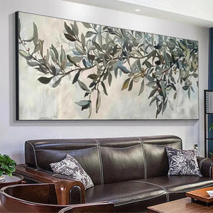 Liam O'Connell olive branch panoramic art on wall above leather sofa