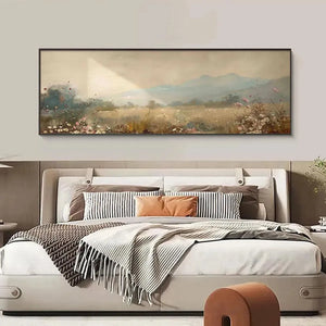 Liam O'Connell's Meadow Valley panoramic painting above bed in a bedroom. Sunlit field, wildflowers, misty mountains.