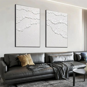 Isabella Rossi's White Waves Diptych: White textured abstract art on canvas, black frame, vertical wall decor.