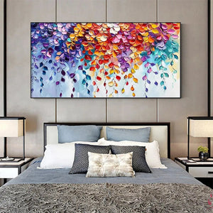 Vibrant textured impasto 'Cascading Color' art over a modern bed, showcasing size in a stylish bedroom.