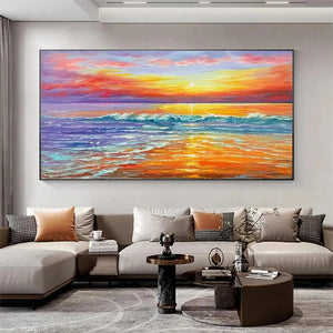Tropical Sunset Beach painting by Liam O'Connell over a modern living room sectional, showcasing vibrant coastal decor.