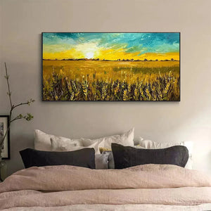 Golden Sunset Field painting by Isabella Rossi above a bed, framed artwork of wheat field at sunset, home decor