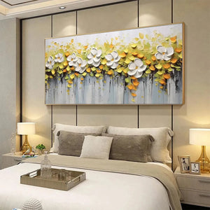 Textured white magnolias impasto painting with raised yellow foliage, displayed in a modern bedroom.